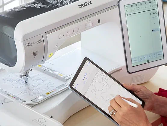 Woman using a mobile device with a Brother embroidery machine